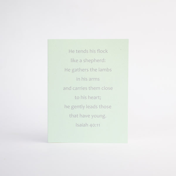 4.25 x 5.5 inch Christian Bible verse greeting card featuring Isaiah 40:11 from the New International Version of the Holy Bible printed on Neenah Royal Sundance Cover (felt finish). Blank in the middle, additional devotional thought on the back, white envelope.